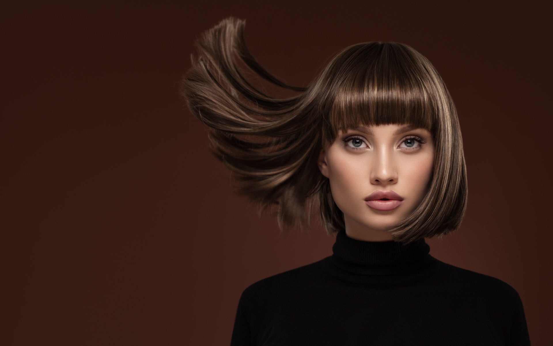 Woman with styled hair and full makeup